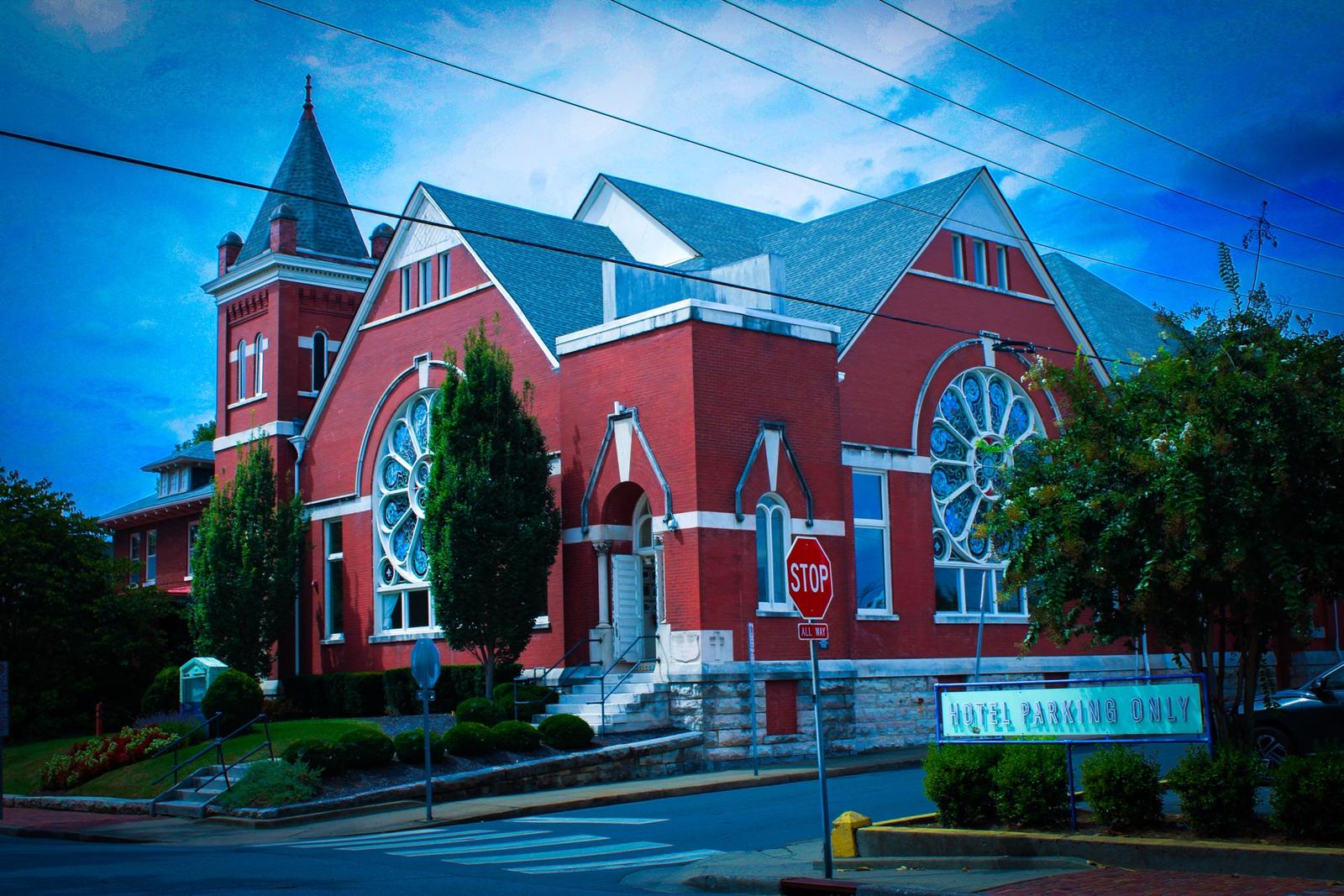 The Russell hotel in Nashville, a red brick former church with rose windows