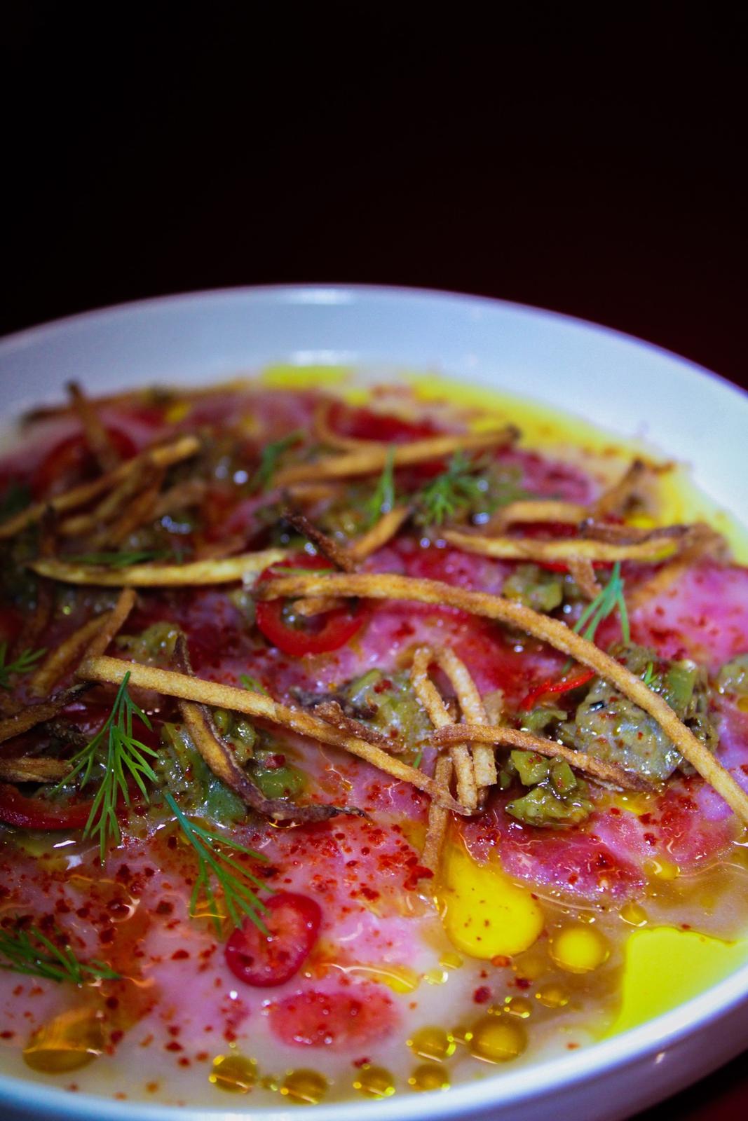 Crudo with chili oil and herbs at Xiao Bao